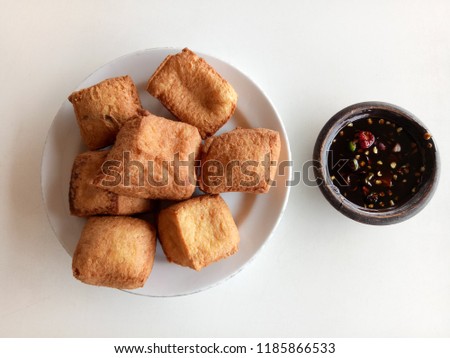 tofu or tahu pong is a traditional typical simple food in Indonesia which made from  soybeans and fried with cooking Royalty-Free Stock Photo #1185866533