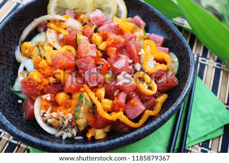 Hawaiian ahi tuna poke bowl served with white rice, vegetables and marinated tuna, close up
