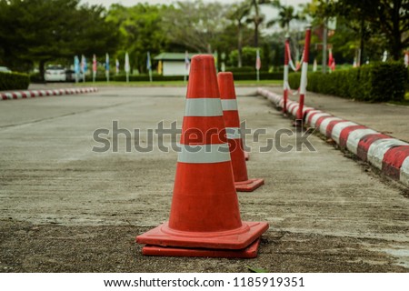cones on a concrete floor in a parking lot 