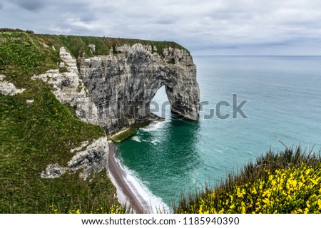 Étretat in Notrmandy, France is famous for its chalk cliffs, including three natural arches.The Manneporte is the third and the biggest one, and cannot be seen from