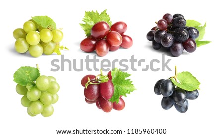 Set with different ripe grapes on white background Royalty-Free Stock Photo #1185960400
