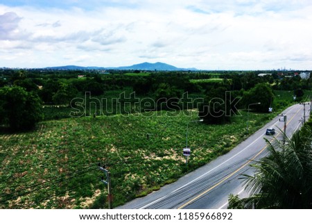 Landscape view of the road of Rayong in Thailand.there are trees and mountains on the side