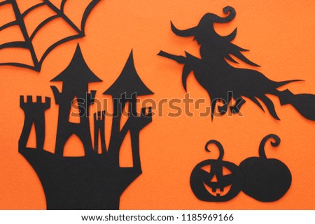Halloween holiday concept. haunted witch house over orange background. Top view, flat lay