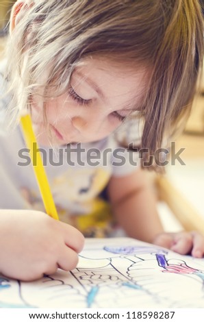 Beautiful girl drawing and painting