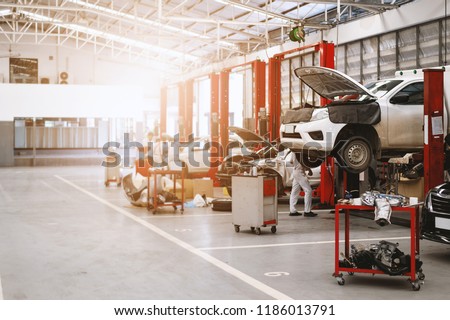car repair station with soft-focus and over light in the background Royalty-Free Stock Photo #1186013791