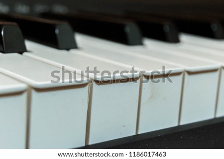 Close-up of some piano keys.