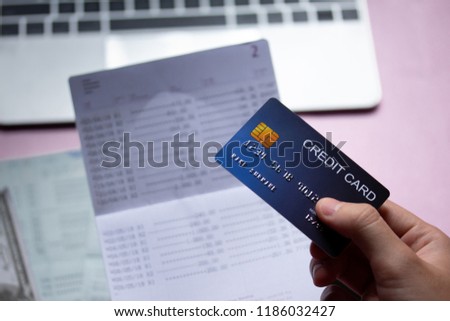 Credit card with bank passbook and credit card spending.
