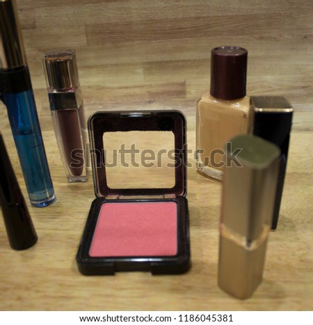 Makeup cosmetics set on wooden dressing table