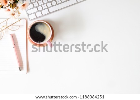 Top view white office desk table with blank notebook, computer keyboard and other office supplies. with copy space, flat lay. Royalty-Free Stock Photo #1186064251