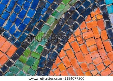 Texture background of mosaic multi colored stones on the wall. Colorful texture background.