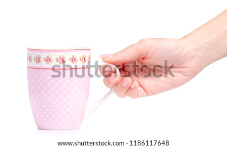 Cup mug vintage pink flower print in hand on white background isolation