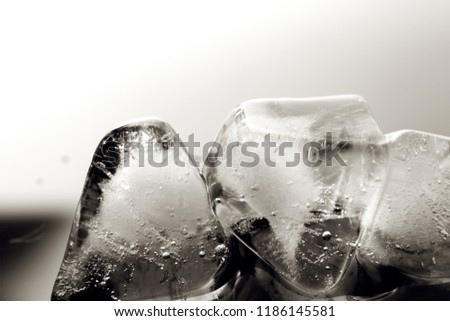 Ice cube background / An ice cube is a small, roughly cube shaped piece of ice conventionally used to cool beverages