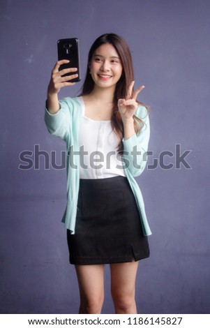 thai china adult office girl white shirt using her smart phone Selfie