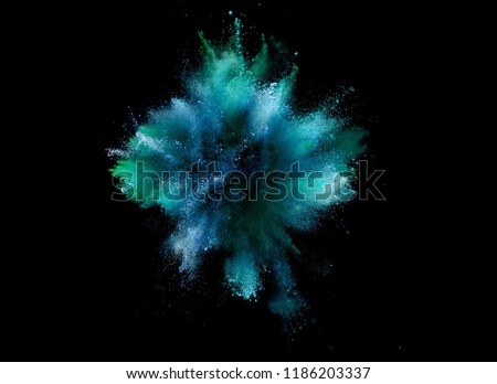 Explosion of coloured powder isolated on black background. Abstract colored background Royalty-Free Stock Photo #1186203337