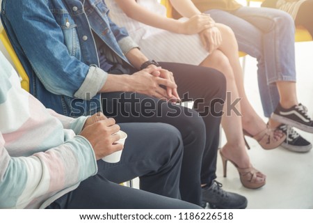 People sitting in circle, aa meeting, support group, therapy and psychiatry concept. Royalty-Free Stock Photo #1186226518