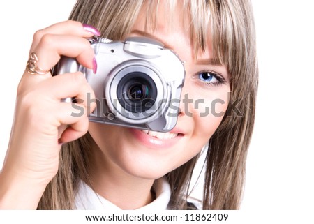 Young woman with digital camera. Isolated on white.
