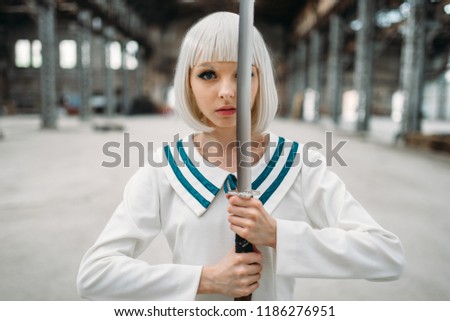 Pretty anime girl with sword, doll with blade