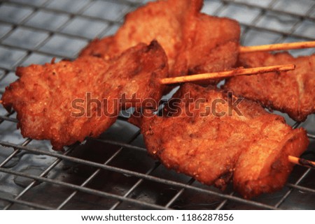 Closeup food picture is crispy fried pork put on the tray grate. 