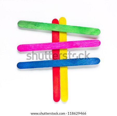 colorful wood ice-cream stick to create a signboard on white background.