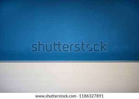Blue wall with white