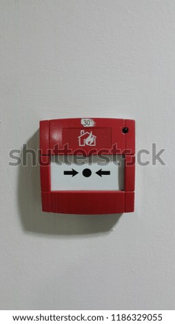 Button on the wall to put out the fire.
