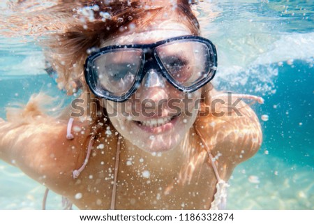 Women diving in the tropical water, snorkeling with mask