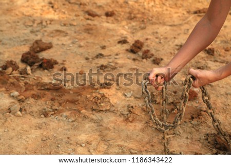Woman Hands In Iron Rusty Chains