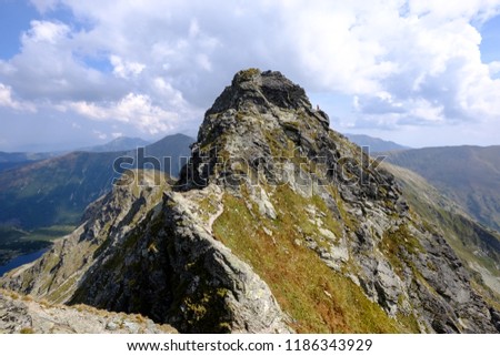 hiking trail in tatra mountains in Slovakia. mounatin view in late summer before autumn, clear sky with some clouds