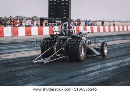 Dragster on the speedway Royalty-Free Stock Photo #1186355245