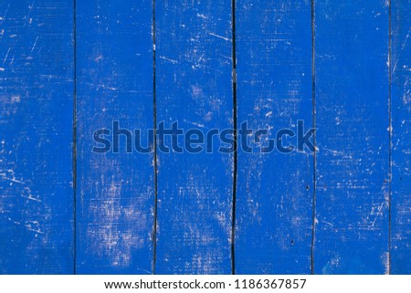 Peeled and faded blue plank wooden texture wallpaper. Tiled. 