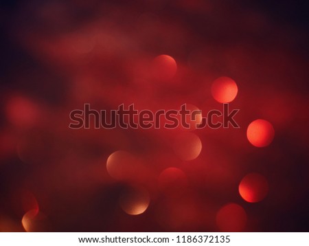 Blurred background lights. Defocused Abstract New Year Christmas background gold, white, red and yellow glitters texture. Shining glowing effects. Holiday concept