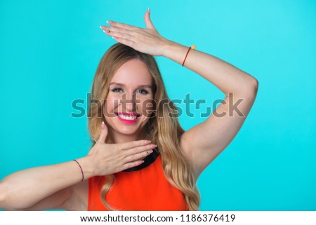 beautiful young girl with her hair on a blue background