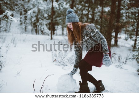 Two young teenage hipster girl friends together.Close up fashion portrait of two sisters hugs and having fun winter time,wearing sweater,best friends couple outdoors, snowy weather