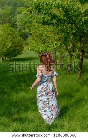 Slavic woman in a fruit garden