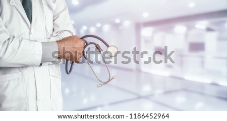 Senior male doctor working at the hospital. Medical healthcare and doctor staff service.