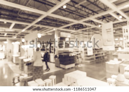 Vintage tone blurred customer shopping for bathroom accessories at furniture retailer store in Texas, America. Defocused wide selection of sets and accessories with huge range of colors, styles