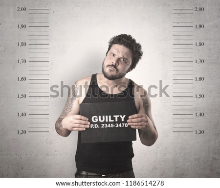 Caught guilty man with ID signs on his hand.
