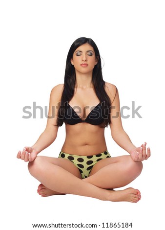 Young ethnic woman sitting in lotus position