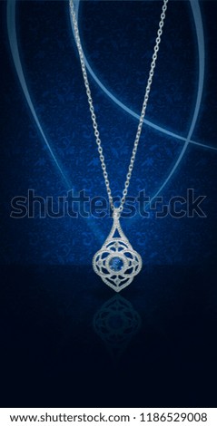 blue sea necklace in a blue background  Royalty-Free Stock Photo #1186529008