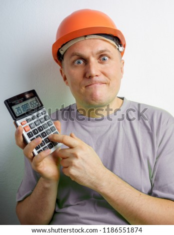 Fun Male Construction Worker Builder in Orange Helmet with Calculator, Concept Architects, Accounting and Analyzing Building Structure, Construction Theme, Constantly Changing Interest Rates
