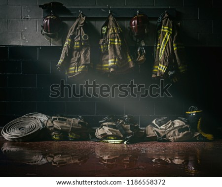        Firefighter clothes in dark firestation                        
