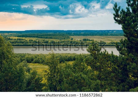 Panorama from the steep bank of the Irtysh River on a September spring day