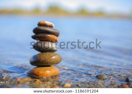 Stones in water stacked and balanced