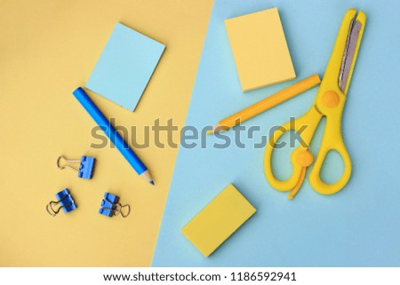 school supplies on a blue and yellow background, Back to school concept, top view