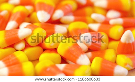 Macro closeup of Halloween traditional Candy Corn treats background.