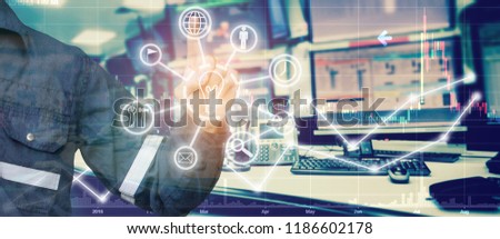 Double exposure of Engineer point in stock trading room with industrial icon computer and graph for Business Trading concept.
