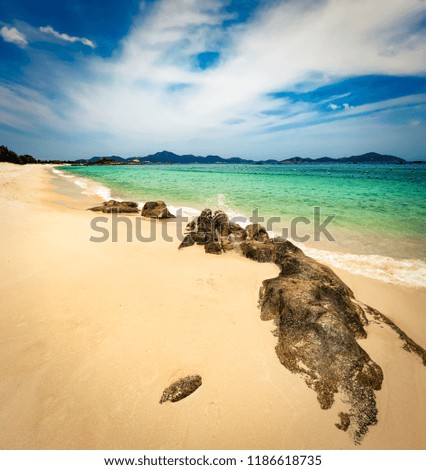 Beautiful white sand beach. Stones on a foreground. Landscape of Vietnam