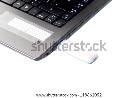 Macro shop of a laptop with a wireless modem in it isolated on white