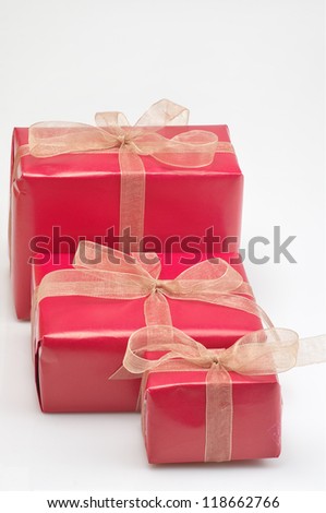 three gift boxes of various sizes on white background