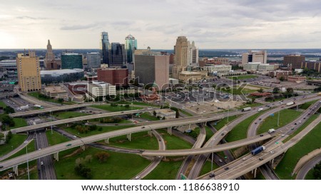 Cars and trucks move in and out of The Downtown City Center of Kansas City Missouri